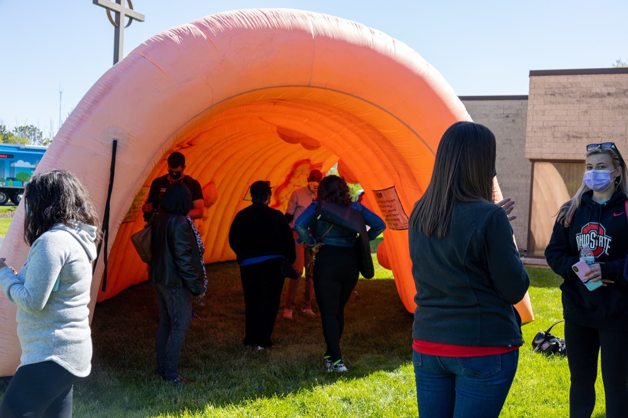 Community health education exhibit with residents and resource tables